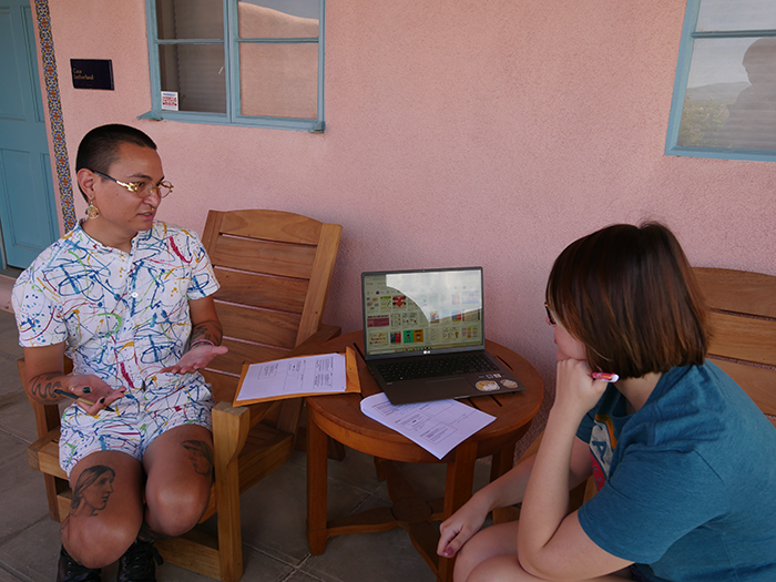 students talking outside at the Doel Reed Center