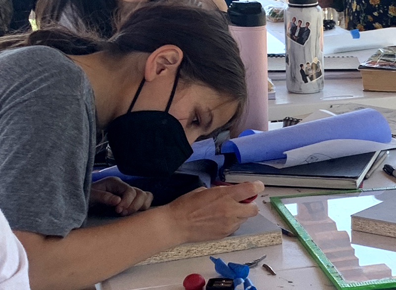 TISA student creating art
